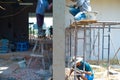 Group of workers plastering the cement on the bricklayer wall Royalty Free Stock Photo