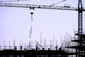 Silhouette of construction site with workers and crane Royalty Free Stock Photo