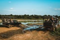 A group of 4x4 touristic Safari jeeps watching elephants and crocodiles in the Udawalawe National Park, Sri Lanka. Popular Asian Royalty Free Stock Photo