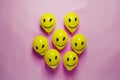 A group of yellow balloons with smiley faces on them. AI generative image Royalty Free Stock Photo
