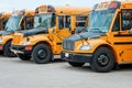 Group of yellow school buses standing in line row in city street outside outdoor. Back to school in September. Education concept. Royalty Free Stock Photo