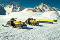 Group of yellow snowmobiles in mountains, Balea lake, Transylvania, Romania Royalty Free Stock Photo