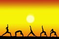 Group of yoga female silhouettes with a sunset on the background and copy space for your text Royalty Free Stock Photo