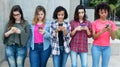 Group of young adult women playing with phone Royalty Free Stock Photo