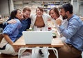 Group of young adults  having a video call at lunchtime in restaurant. fun, technology, online, internet, friends, business Royalty Free Stock Photo