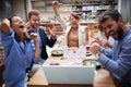 Group of young adults having a video call in restaurant, celcebrating. technology, business partners, colleagues online, internet Royalty Free Stock Photo