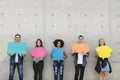 Group of young adults outdoors holding empty placard copyspace t Royalty Free Stock Photo