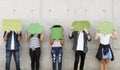 Group of young adults outdoors holding empty placard copyspace t Royalty Free Stock Photo