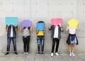 Group of young adults outdoors holding empty placard Royalty Free Stock Photo