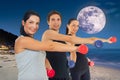 Group of Young Adults Smiling Together on the Beach Under the Night Sky Royalty Free Stock Photo