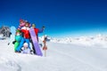 Group of young adults snowboarders in the mountain