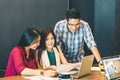 Group of young Asian business colleagues or college students in team casual discussion, startup project business meeting Royalty Free Stock Photo