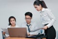 Group of young Asian business people working together in the office. Business teamwork cooperation partnership concept Royalty Free Stock Photo