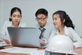 Group of young Asian business people working together in the office. Business teamwork cooperation partnership concept Royalty Free Stock Photo