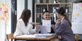 Group of young asian modern people in smart casual wear having a brainstorm meeting. Group of young asian business Royalty Free Stock Photo