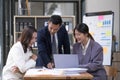 Group of young asian modern people in smart casual wear having a brainstorm meeting. Group of young asian business Royalty Free Stock Photo