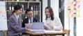 Group of young asian modern people in smart casual wear having a brainstorm meeting. Group of young asian business Royalty Free Stock Photo