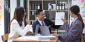 Group of young asian modern people in smart casual wear having a brainstorm meeting. Group of young asian business Royalty Free Stock Photo