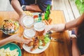 Group of young asian people celebrating beer festivals happy while enjoying home party Royalty Free Stock Photo