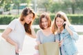 Group of young Asian Woman shopping in an outdoor market with shopping bags in their hands. Royalty Free Stock Photo