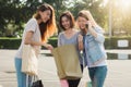 Group of young Asian woman shopping in an outdoor market with shopping bags in their hands. Royalty Free Stock Photo