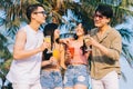 A group of young asians enjoy a trip to the sea on a summer vacation Royalty Free Stock Photo