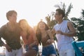 A group of young asians enjoy a trip to the sea on a summer vacation