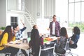 Group of young attractive asian creative design team meeting,smiling and laughing at office workshop. Asian employee engaged Royalty Free Stock Photo