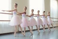 Group of young ballerinas training choreography, copy space