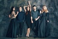 Group of young beautiful people posing in studio