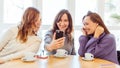 Group of young beautiful smiling women drinking coffee Royalty Free Stock Photo