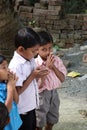 A group of young Bengali Catholics pray before a statue of the Blessed Virgin Mary in Bosonti, India Royalty Free Stock Photo