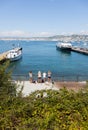 A group of young blonde girls waiting for their ferry on the doc