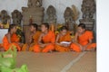 Young bouddist monk waiting for class