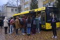 Group of young boys and girls standing in front of the school bus ready to get on. Kyiv, Ukraine Royalty Free Stock Photo