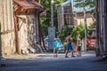 A group of young boys play ball in a back alley in Old Town Tbilisi surrounded by ramshackle