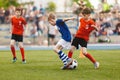 Group of young boys playing soccer game. Football match between youth soccer teams Royalty Free Stock Photo