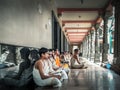 Group of young boys sitting on the ground and reading books in Vedic Hindu Religious Study School