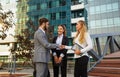 Group of business man and woman team at office shaking hands outdoors Royalty Free Stock Photo