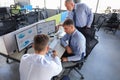 Group of young business men in formalwear working using computers while sitting in the office Royalty Free Stock Photo