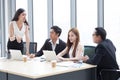 Group of young business people brainstorming together in the meeting room . Businesswoman presenting to colleagues .teamwork Royalty Free Stock Photo