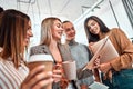 Group young business people gathered together discussing creative idea and drink coffee Royalty Free Stock Photo