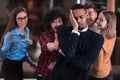 A group of young business people have fun playing interesting games while taking a break from work in a modern office Royalty Free Stock Photo