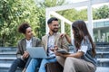 Group of young business people, job candidates standing in front of the office building waiting to be called to meeting with the