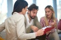 A group of young business people at a meeting discussing some important data from documents. People, business, meeting Royalty Free Stock Photo