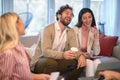 A group of young business people at a meeting having fun together at a break of work. People, business, meeting Royalty Free Stock Photo