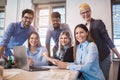 Group of young business people in smart casual wear working together Royalty Free Stock Photo