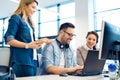 Group of business people and software developers working as a team in office Royalty Free Stock Photo