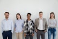 Group of young business people standing looking at camera Royalty Free Stock Photo