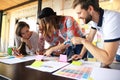 Group of young business people , Startup entrepreneurs working on their venture in coworking space.